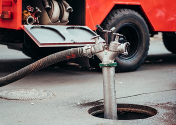 Fire Hydrant In Use During a Structure Fire